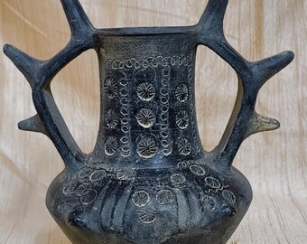 Bulbous Clay Vessel, Stylized Antler Handles, Black Clay Pottery, Floral Rosette Patterns, Faded Decorative Motifs, Handmade Terracotta Vase
