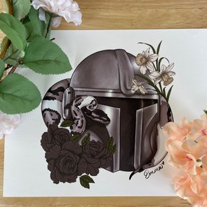 May include: A black and white snake wraps around a gray and silver helmet with a black visor. The helmet is surrounded by black roses and white daffodils. The image is signed "Emma" in the bottom right corner.