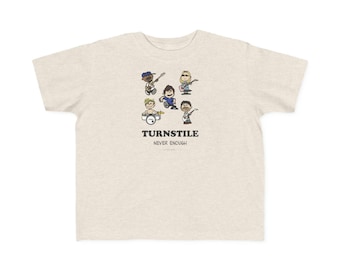 May include: A heathered beige short-sleeve t-shirt featuring a cartoon illustration of five band members playing instruments. Below the graphic, the text reads TURNSTILE and NEVER ENOUGH in a bold, black, serif font style.