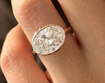5 Carat Oval Lab Grown Diamond East West Half Bezel Engagement Ring in Rose Gold: Flush Fit Pave Bridge Diamond Ring.