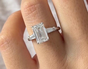 3 Carat Emerald Cut Lab Diamond and Tapered Baguettes Three Stone Ring in White Gold