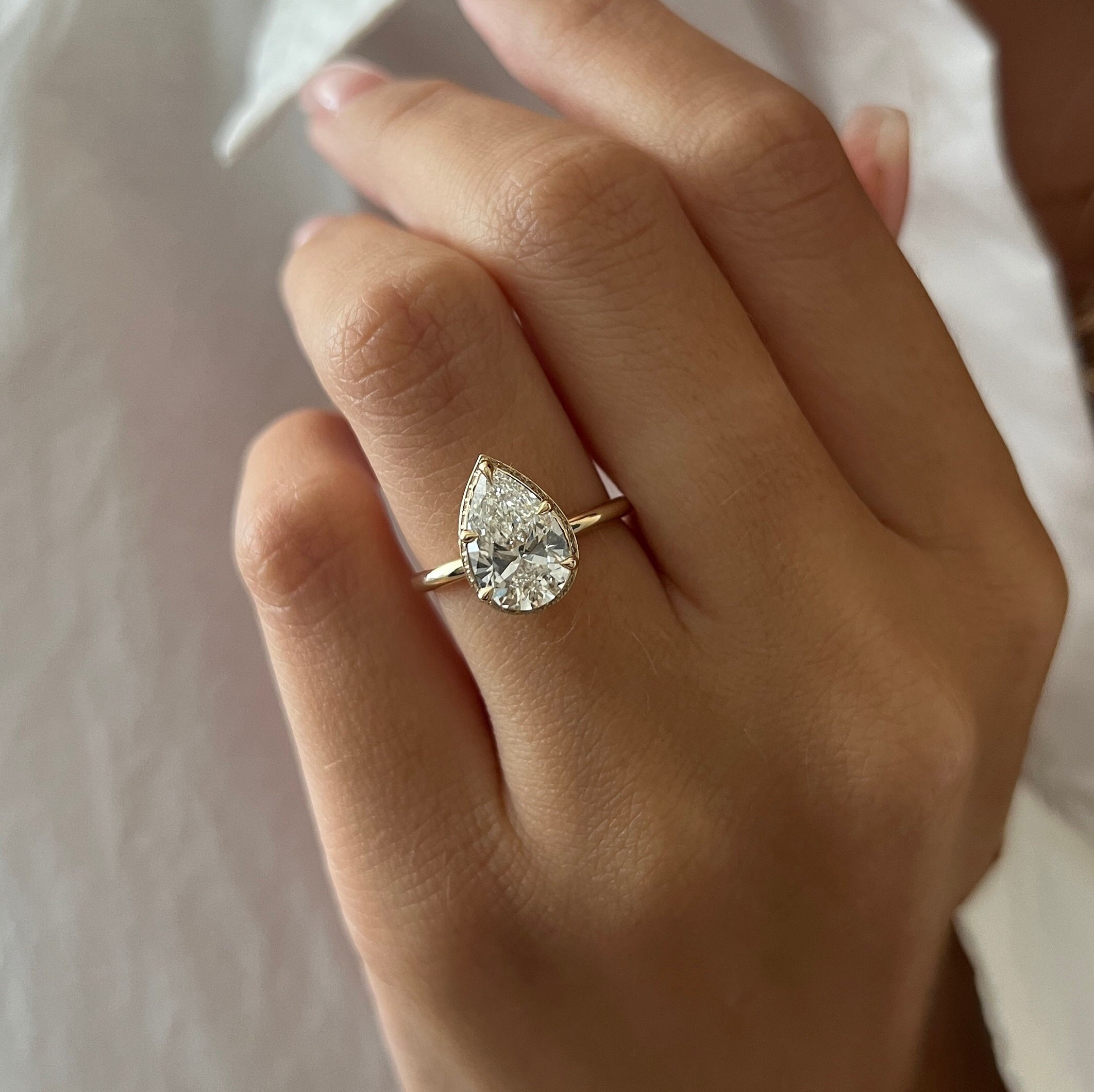 Pear shaped ring gold band best sale