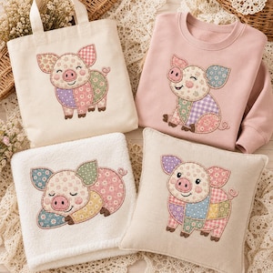 May include: A collection featuring a cream canvas tote bag, a light pink sweatshirt, a white plush blanket, and a beige square pillow. Each item displays a patchwork-style pig illustration with floral, gingham, and polka dot patterns in pastel colors.