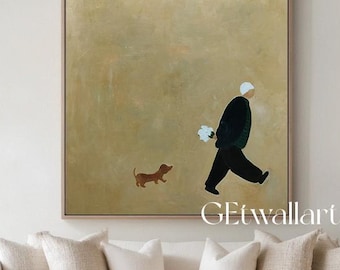 May include: A square canvas wall art piece featuring a minimalist painting of a person in a dark coat walking a small brown dog against a solid, muted beige background. The artwork is displayed in a thin frame and includes the text GEwallartgallery.