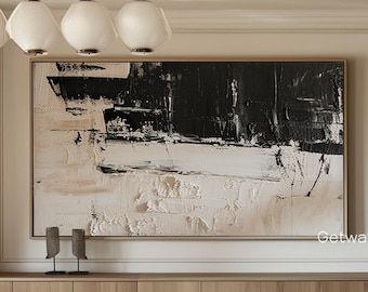 May include: A modern dining room with a large abstract painting in black, white, and beige tones. The painting is above a wooden table with a fluffy white bowl and six chairs with fluffy beige seats. The text "Getwallartgallery" is visible in the bottom right corner of the image.