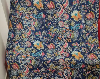 May include: A blue kantha quilt with a floral and paisley pattern. The quilt is made of cotton and has a hand-stitched design.