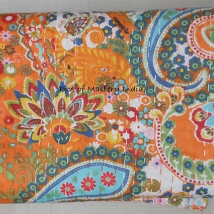 May include: A colourful kantha quilt with a paisley pattern in shades of orange, blue, green, and red. The quilt is hand-stitched with white thread and has a white background.