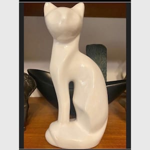 White ceramic cat figurine from the 1960s