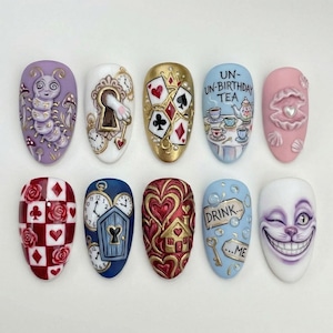May include: A set of ten artificial nails with various designs inspired by Alice in Wonderland. Designs include a caterpillar, playing cards, a keyhole, a tea party, a pearl, a rose pattern, a door with clocks, a house, and the Cheshire Cat.