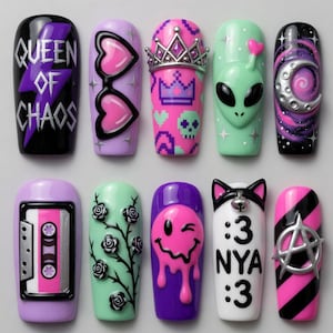 May include: A set of ten artificial nails with various designs. The designs include a cassette tape, a winking face, an alien, a crown, and the text "QUEEN OF CHAOS". Colors include black, purple, pink, and green.