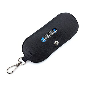 May include: A black leather key chain with a silver clasp and a small black leather pouch with a blue and silver multi-tool inside.