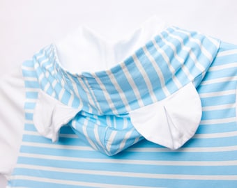 May include: A blue and white striped hooded shirt with white ear-like flaps on the hood.