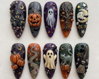 May include: A set of ten almond-shaped press-on nails featuring detailed Halloween designs including a haunted house, jack-o'-lanterns, ghosts, a bare tree, a crescent moon, stars, a black cat, and a broomstick, accented with small rhinestones.
