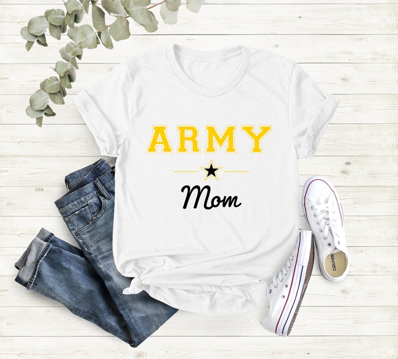 May include: White t-shirt with the text "ARMY Mom" in yellow and black lettering. A black star is above the word "Mom".