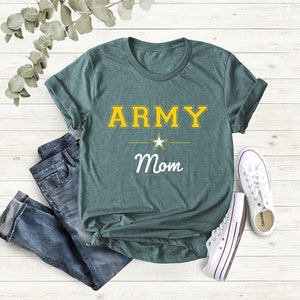 May include: Teal blue t-shirt with the text "ARMY Mom" in yellow and white lettering. A white star is between the words "ARMY" and "Mom".