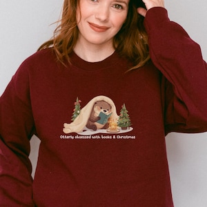 Cute Otter Christmas Sweatshirt, Bookworm Holiday Sweater, Cozy Reading Crewneck, Funny Otter Lover Top, Book Lover Gift