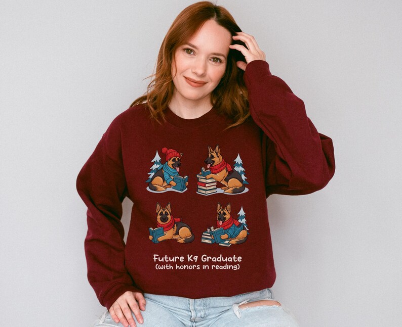 Future K9 Graduate Sweatshirt. This cozy German Shepherd shirt features four cute German Shepherds reading books, making it a perfect dog lover gift. It's an ideal bookish jumper and a great Xmas gift for dog moms and dog dads who love reading. This holiday sweatshirt is a funny and charming way to celebrate a love for dogs and books during the winter holiday season.