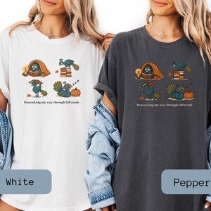 Comfort Colors shirt with whimsical peacock illustrations reading books, paired with pumpkins and cozy fall designs, perfect book lover tee.
Book Lover Comfort Colors Tee.nautumn gift for bookworms, librarians, teachers, and peacock lovers.
peacock shirt, funny peacock tee, peacock lover gift, book lover shirt, fall reading shirt, comfort colors tee, bookish shirt, librarian gift, cute peacock shirt, autumn book shirt, teacher gift tee, book club shirt, cozy fall shirt