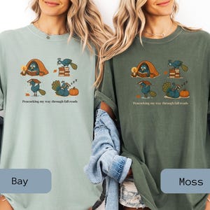 Comfort Colors shirt with whimsical peacock illustrations reading books, paired with pumpkins and cozy fall designs, perfect book lover tee.
Book Lover Comfort Colors Tee.nautumn gift for bookworms, librarians, teachers, and peacock lovers.
peacock shirt, funny peacock tee, peacock lover gift, book lover shirt, fall reading shirt, comfort colors tee, bookish shirt, librarian gift, cute peacock shirt, autumn book shirt, teacher gift tee, book club shirt, cozy fall shirt