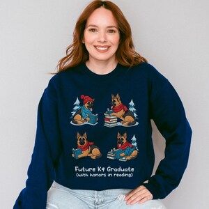 Future K9 Graduate Sweatshirt. This cozy German Shepherd shirt features four cute German Shepherds reading books, making it a perfect dog lover gift. It's an ideal bookish jumper and a great Xmas gift for dog moms and dog dads who love reading. This holiday sweatshirt is a funny and charming way to celebrate a love for dogs and books during the winter holiday season.