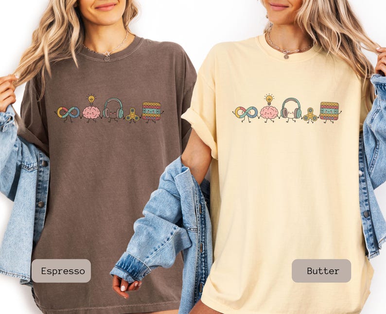 Comfort Colors Autism Doodle Characters Shirt featuring colorful, hand-drawn inclusive characters. Neatly styled next to classroom supplies, making it an ideal inclusion shirt, autism teacher shirt, and back to school shirt.