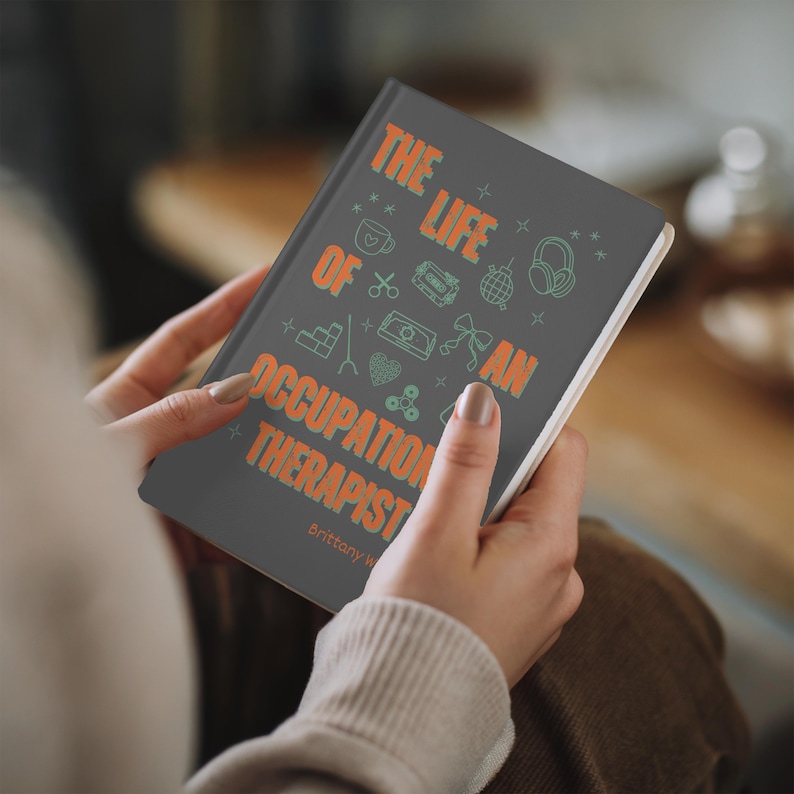 “Personalized Occupational Therapist Journal featuring orange and green design with medical icons, stethoscope, and bow illustration. Custom hardcover notebook gift for OT students, occupational therapists, and therapy professionals.”