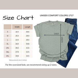 Comfort Colors Autism Doodle Characters Shirt featuring colorful, hand-drawn inclusive characters. Neatly styled next to classroom supplies, making it an ideal inclusion shirt, autism teacher shirt, and back to school shirt.
