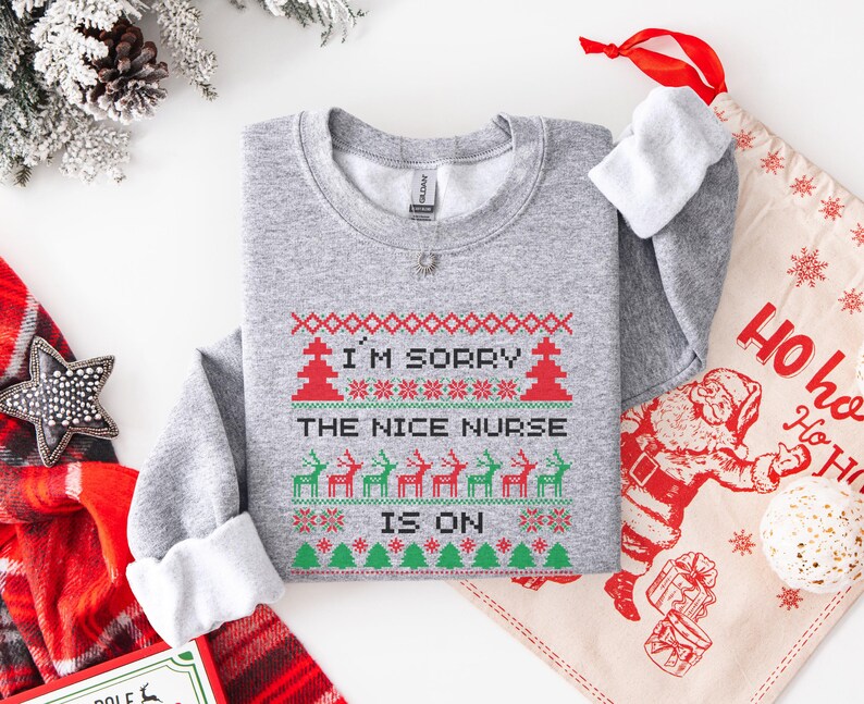 A Funny Nurse Gift sweatshirt, designed like an Ugly Xmas Sweater, with the sarcastic phrase "I'm Sorry The Nice Nurse Is On Vacation." This is ideal for an RN LPN Nurse or ICU Nurse Gif