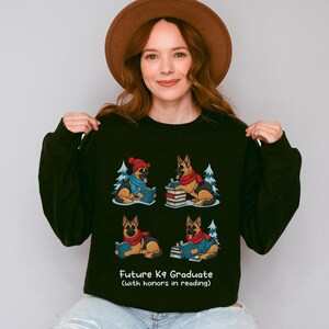 Future K9 Graduate Sweatshirt. This cozy German Shepherd shirt features four cute German Shepherds reading books, making it a perfect dog lover gift. It's an ideal bookish jumper and a great Xmas gift for dog moms and dog dads who love reading. This holiday sweatshirt is a funny and charming way to celebrate a love for dogs and books during the winter holiday season.