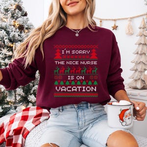A Funny Nurse Gift sweatshirt, designed like an Ugly Xmas Sweater, with the sarcastic phrase "I'm Sorry The Nice Nurse Is On Vacation." This is ideal for an RN LPN Nurse or ICU Nurse Gif
