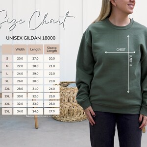 May include: An olive green unisex Gildan 18000 sweatshirt. A size chart shows measurements in inches for width, length, and sleeve length, ranging from size S to 5XL. The chart includes chest and length measurements. The model is wearing the sweatshirt.