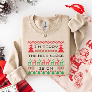 A Funny Nurse Gift sweatshirt, designed like an Ugly Xmas Sweater, with the sarcastic phrase "I'm Sorry The Nice Nurse Is On Vacation." This is ideal for an RN LPN Nurse or ICU Nurse Gif