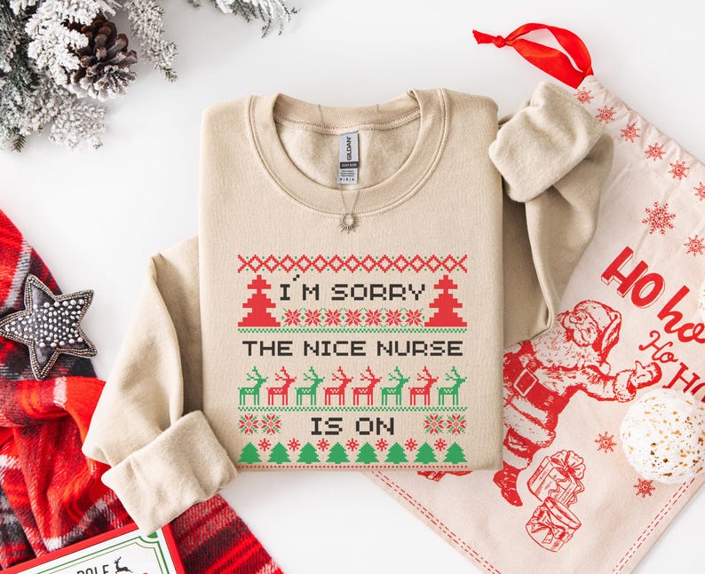 A Funny Nurse Gift sweatshirt, designed like an Ugly Xmas Sweater, with the sarcastic phrase "I'm Sorry The Nice Nurse Is On Vacation." This is ideal for an RN LPN Nurse or ICU Nurse Gif