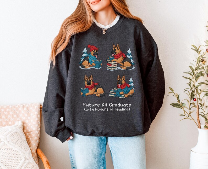 Future K9 Graduate Sweatshirt. This cozy German Shepherd shirt features four cute German Shepherds reading books, making it a perfect dog lover gift. It's an ideal bookish jumper and a great Xmas gift for dog moms and dog dads who love reading. This holiday sweatshirt is a funny and charming way to celebrate a love for dogs and books during the winter holiday season.