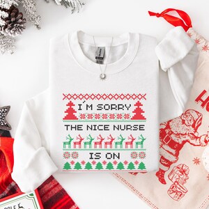 A Funny Nurse Gift sweatshirt, designed like an Ugly Xmas Sweater, with the sarcastic phrase "I'm Sorry The Nice Nurse Is On Vacation." This is ideal for an RN LPN Nurse or ICU Nurse Gif