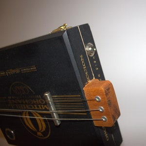 cigar box guitar, a beautiful novelty gift. Hand made. can be plugged into an amp