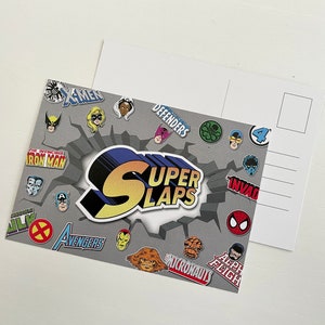 Colourful A6 sized postcard against a white background. Super Slaps branded with lots of Marvel super hero face and logo stickers. Also shows back of the postcard which is blank apart from address and stamp space.