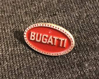 Bellissima spilla Bugatti vintage smaltata bordeaux e bronzo color oro