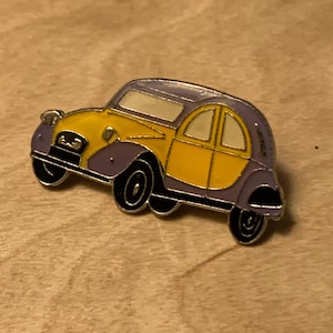 Iconic yellow and grey Citroen 2CV car lapel pin