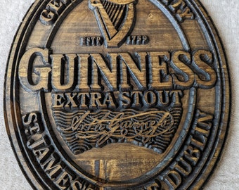 Large carved wooden Guinness bar sign.