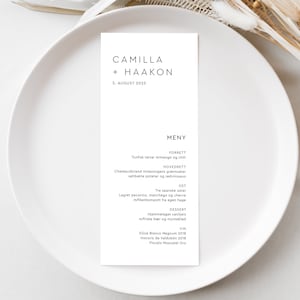 May include: A white menu card with black text listing the menu for a wedding reception. The menu includes a tuna tartar starter, a chateaubriand main course, a cheese course, a dessert, and a wine list. The card is titled "Camilla + Haakon" and the date is "5. August 2023".