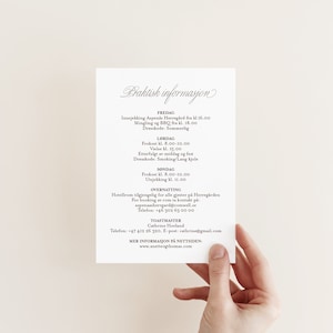 May include: A brown card with white text outlining the practical information for a wedding weekend. The card includes the dates and times for check-in, a BBQ, a wedding ceremony, a reception, and check-out. It also includes the name and contact information for the wedding planner and the website for the venue.