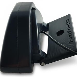 May include: A black 3D printer component with the text "FastPrint3D" on a rectangular base. The component has a curved, rounded top and a small hole. A black wire extends from the base.