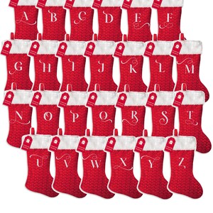 May include: Set of 26 red Christmas stockings with white faux fur trim and a white letter embroidered on each stocking. The letters are A through Z.