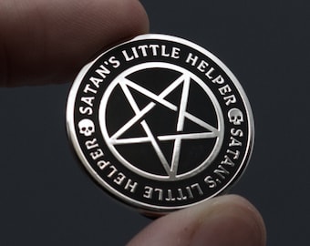 May include: A silver-colored pin with a black pentagram and the text "Satan's Little Helper & Satan's Little Helper" around the edge.