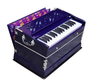 May include: A blue wooden harmonium with a white keyboard and a floral patterned lid. The harmonium has silver accents and a decorative design on the front.