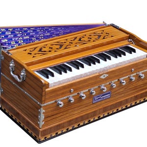 May include: A wooden harmonium with a purple bellows, a keyboard with white and black keys, and a row of silver knobs. The harmonium has a carved wooden design on the top and a label that reads "Legend Instruments".