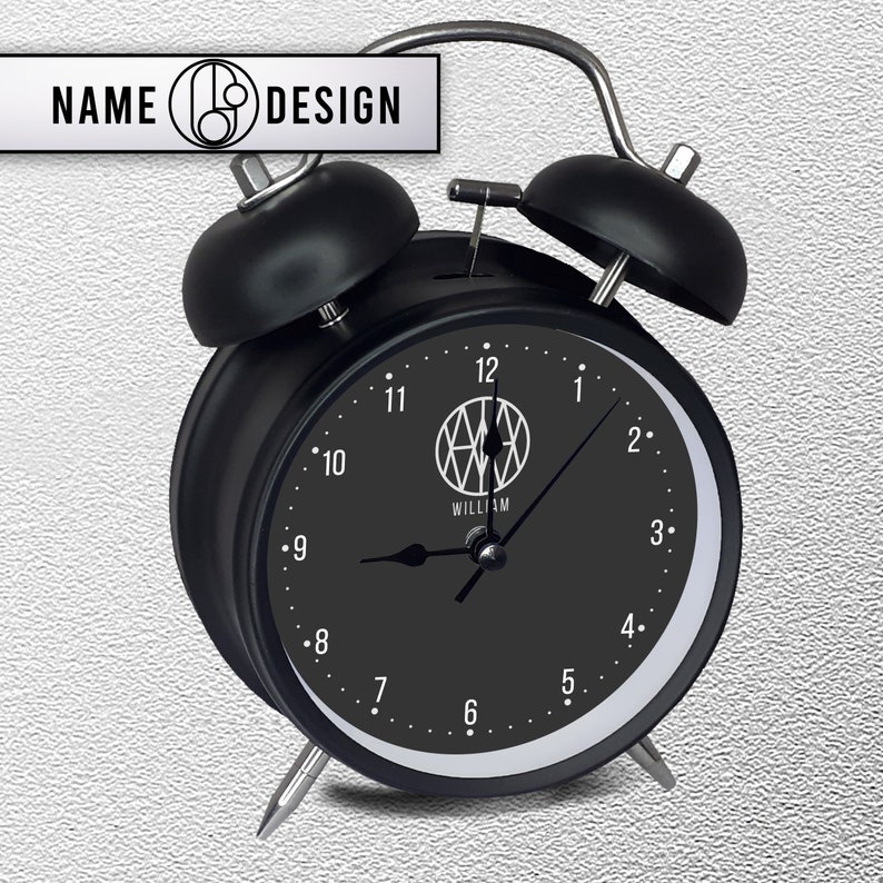 black metal alarm clock with name logo