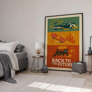 May include: A framed poster with a Back to the Future theme. The poster features a DeLorean, a skateboard, and a train, each in a different section. The words "BACK TO THE FUTURE" are at the bottom in white text.