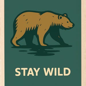 May include: A framed print with a brown bear illustration on a dark green background. The text "STAY WILD" is displayed in white block letters. The artwork has a minimalist style and evokes a sense of the outdoors.